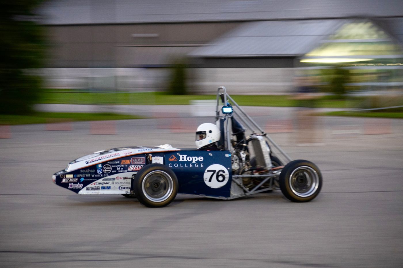 Hope College's car number 76 at speed on a cone course